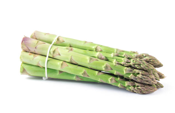 istock Fresh green asparagus on white 956421958