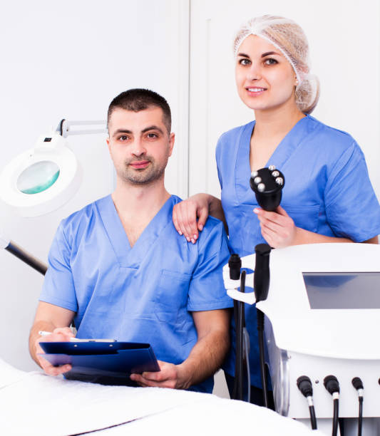 istock Two confident beauticians working in clinic 956426062