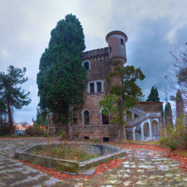 Small ruined abandoned castle overgrown in vegetation, in Ecka , Serbia