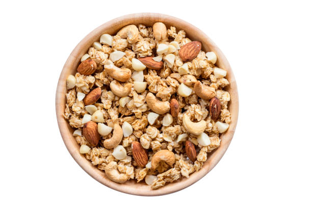 istock Close up top view granola in the bowl on isolated with clipping path. 956427738