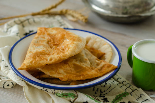istock Traditional turkish borek, ciborek on the wooden table, 956428322