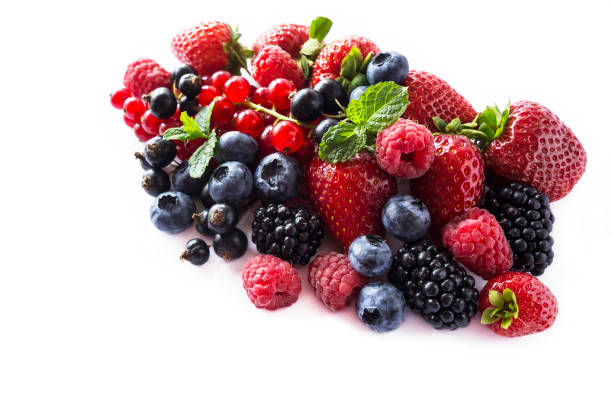 istock Fruits and berries isolated on white background. Ripe currants, raspberries, blueberries, strawberries and blackberries with a mint leaf. Sweet and juicy fruits with copy space for text. Various fresh summer. Background of mix fruits on a white background 956431266