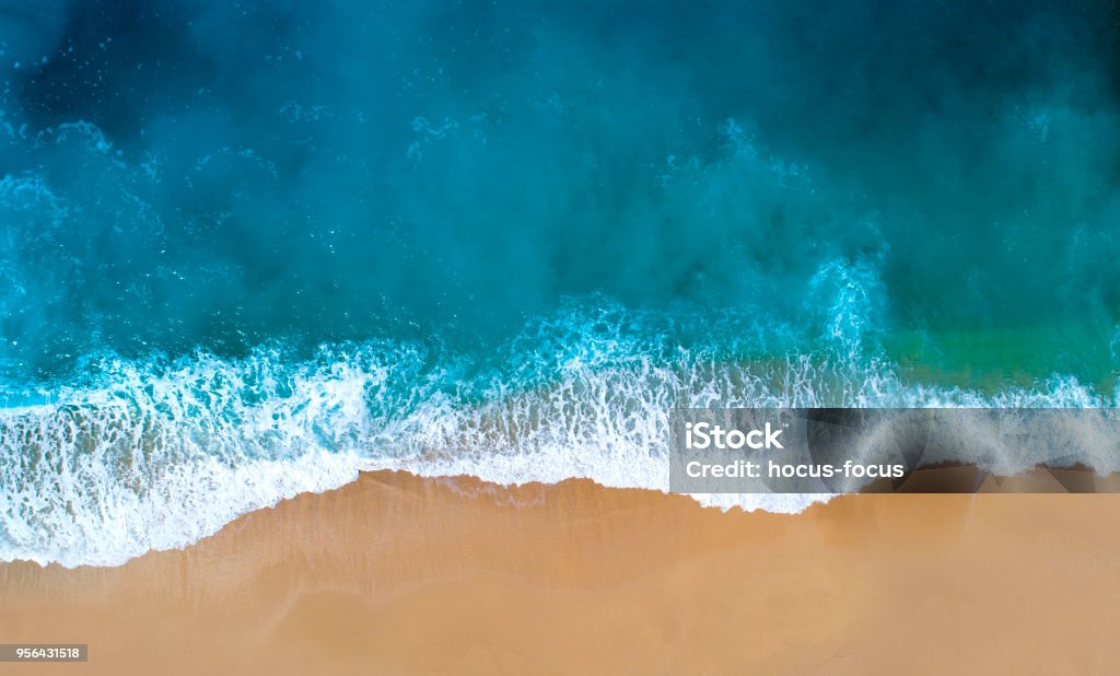 Aerial view of clear turquoise sea Aerial view of sandy beach, clear turquoise water. Mediterranean sea. Beach Stock Photo