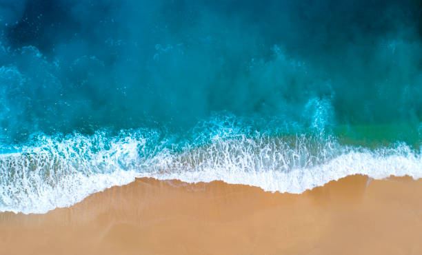 Aerial view of clear turquoise sea Aerial view of sandy beach, clear turquoise water. Mediterranean sea. helicopter point of view photos stock pictures, royalty-free photos & images