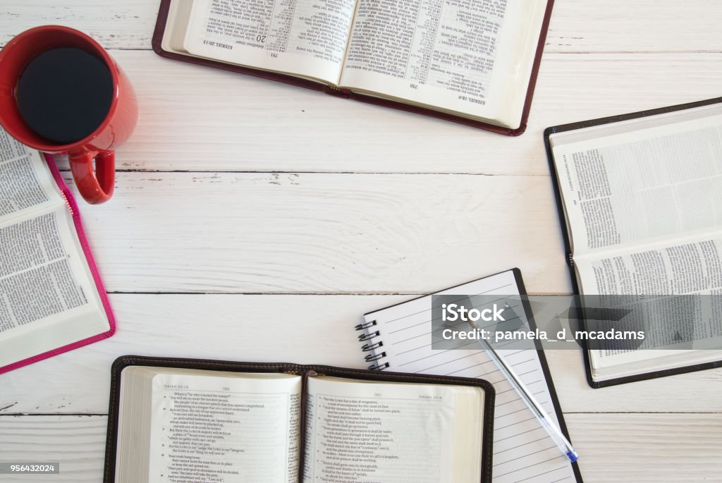 Group Bible Study on a White Wood Table Bible Stock Photo