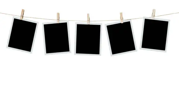 Photo of five photo frame blank hanging on isolated white with clipping path.