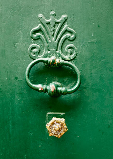 istock Brass door knob on a green door 956435522