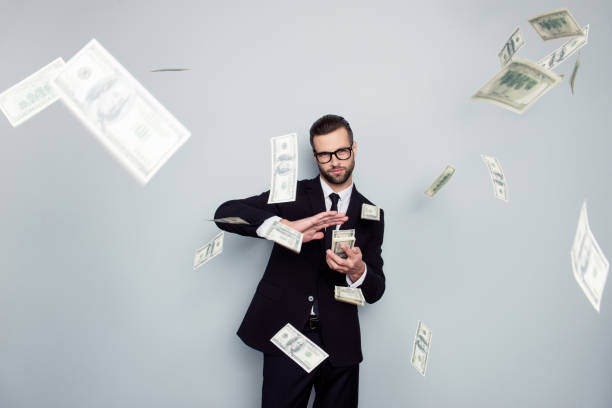 spectacles jackpot entrepreneur economist banker chic posh manager jacket concept. handsome confident cunning clever wealthy rich luxury guy holding wasting stack of money isolated on gray background - bank currency stack coin imagens e fotografias de stock