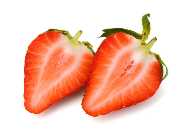 istock Two sliced strawberries isolated on white 956441098