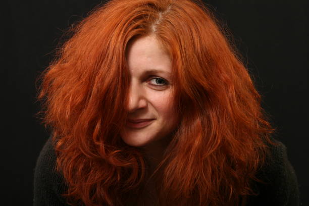 istock Young woman with red hair talking 956451202