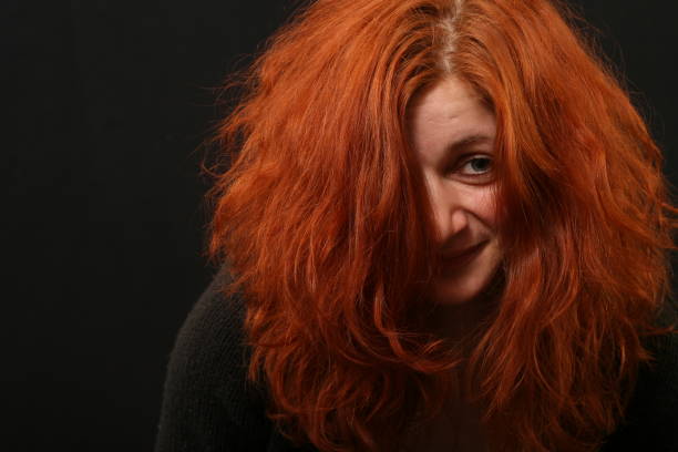 istock Young woman with red hair talking 956451214