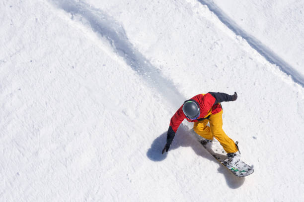 istock Snowboarder riding on loose snow Freeride 956451248