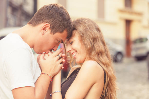 istock Couple in love holding hands. 956454786