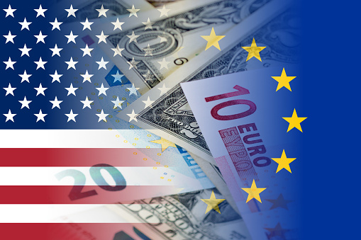 us and eu flags with euro and dollar banknotes mixed image