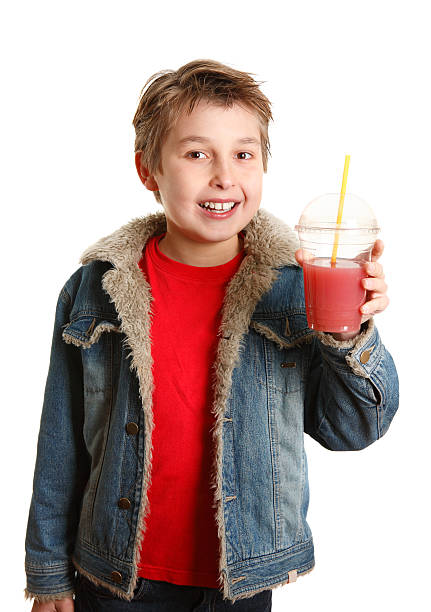 istock Happy healthy boy holding fresh fruit juice in clear cup 95646166