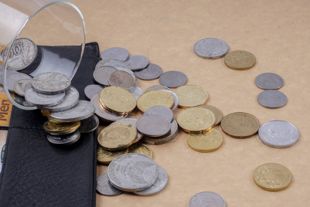 istock High Angle View Of Coins On Table 956473366