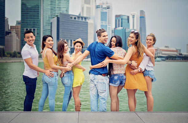 istock Happy friends are hugging and make fun together 956478364