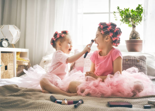 istock sisters are doing hair and having fun 956486974