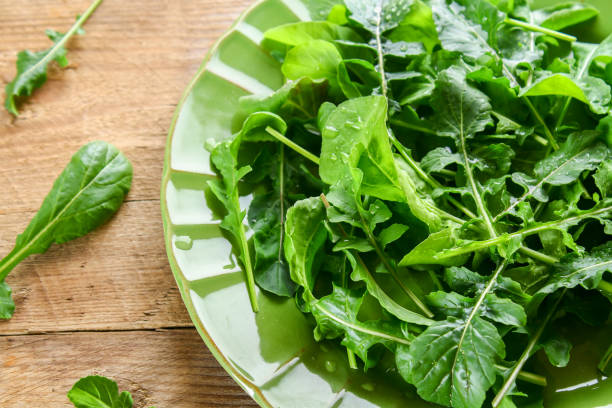 istock Fresh green home arugula leaves, rucola. Salad. 956487316