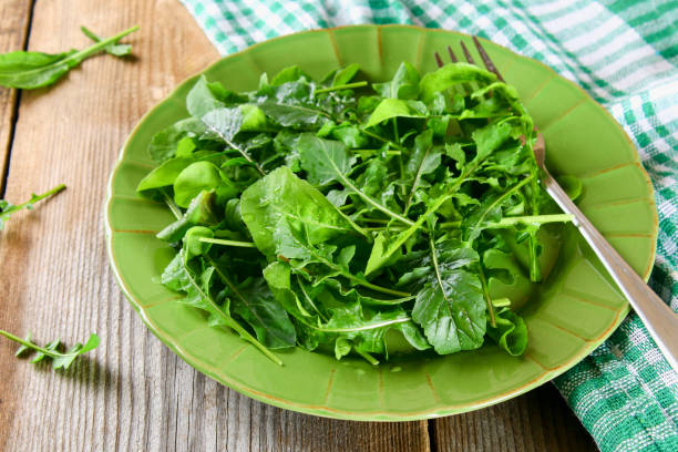 istock Fresh green home arugula leaves, rucola. Salad. 956487332