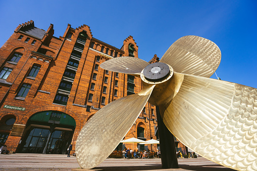 Hamburg, Germany - May 17, 2018: Giant four-blade ship propeller in front of the International Maritime Museum in Hamburg's Speicherstadt district.