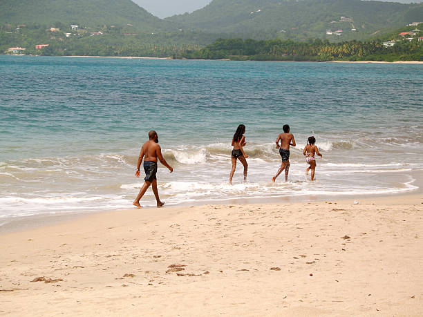 istock father and kids in line on beach 95648981