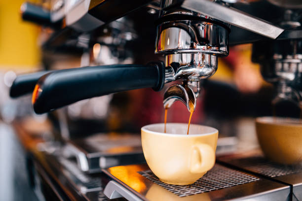 istock Details of professional coffee brewing machine preparing hot espresso 956490644