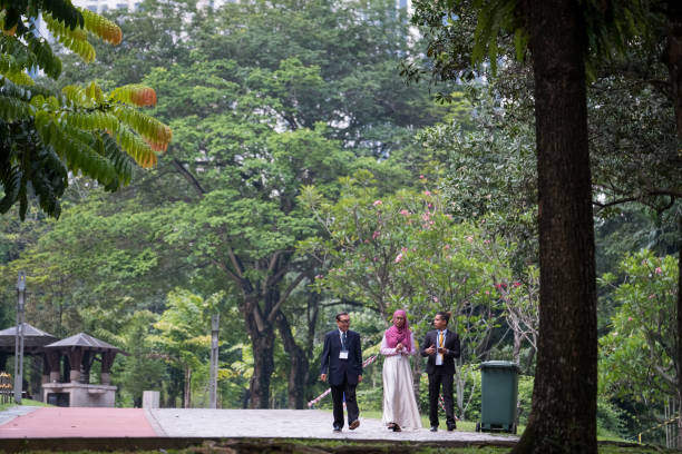 istock Business Colleagues walk in the park 956491748