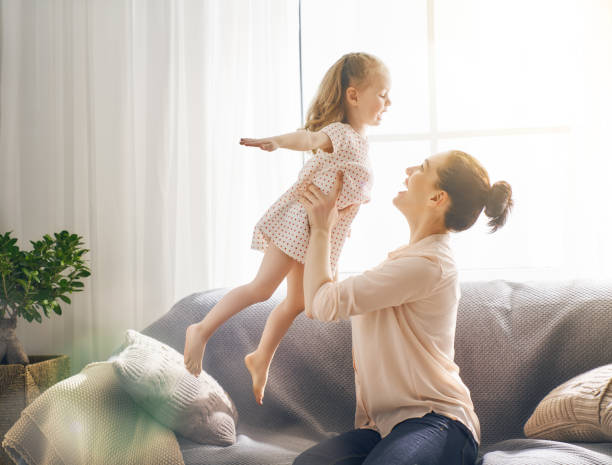 istock mother and daughter playing 956492046