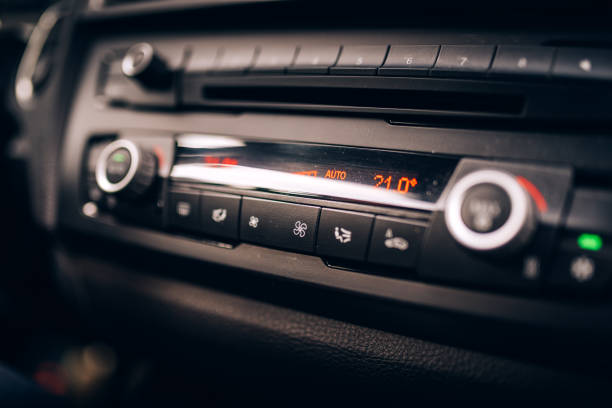 istock Car clima controls, radio dashboard and cockpit close up 956495204