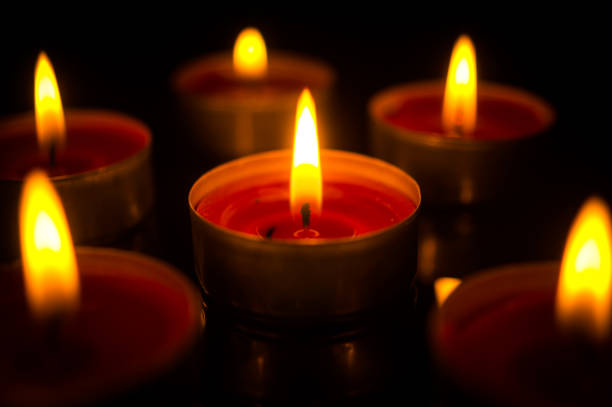 istock A few burning candles in the dark 956495326