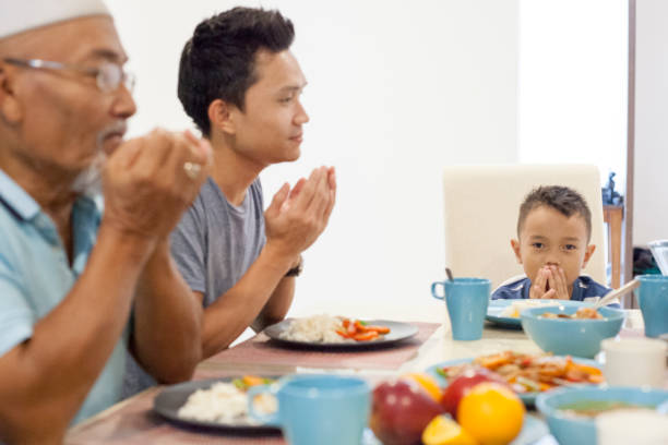istock Elderly Malay father with his son and grandson at the dining table 956495764