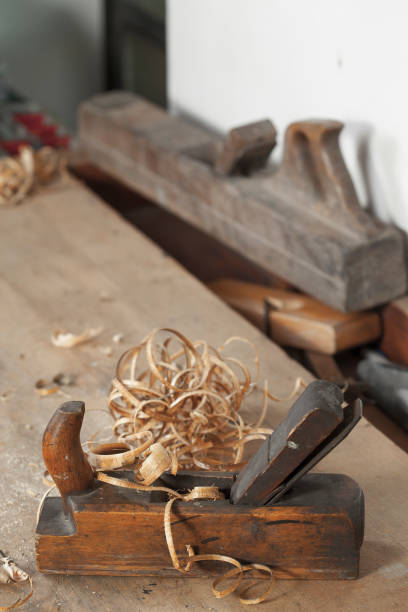 istock carpenter hand plane on wooden background 956496684