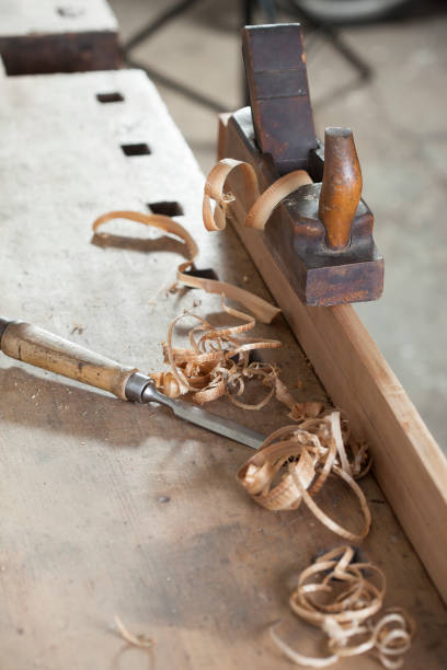 istock carpenter hand plane on wooden background 956496712