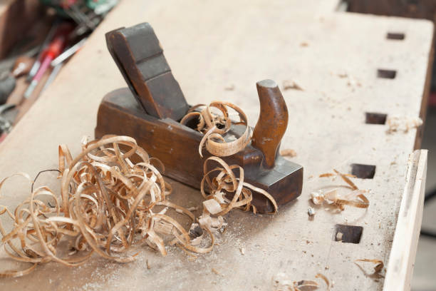 istock carpenter hand plane on wooden background 956496722