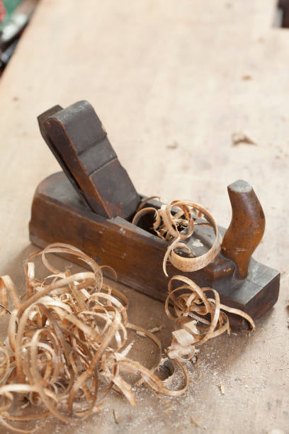 istock carpenter hand plane on wooden background 956496740