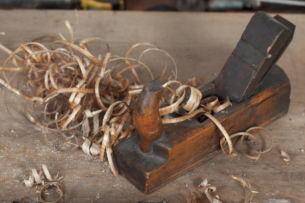 istock carpenter hand plane on wooden background 956496750