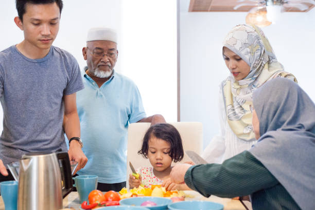 istock Malay family preparing food ingredients 956496996