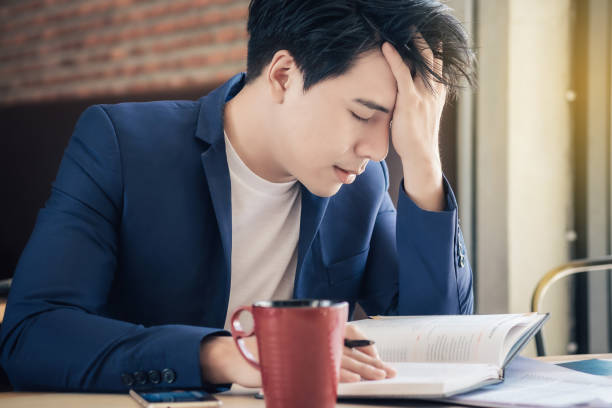 istock Tired Businessman Working At Office 956499388