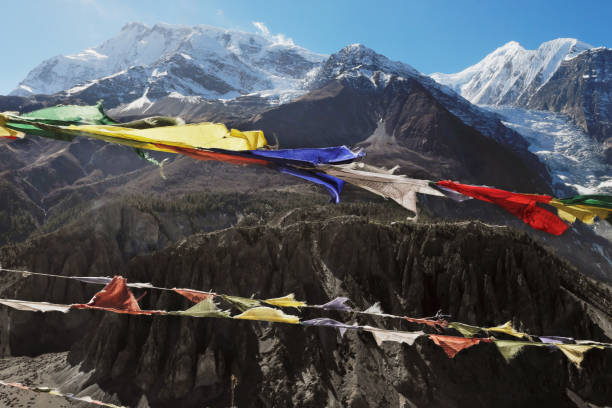 istock Buddhist flags against the background of snowy peaks 956501182