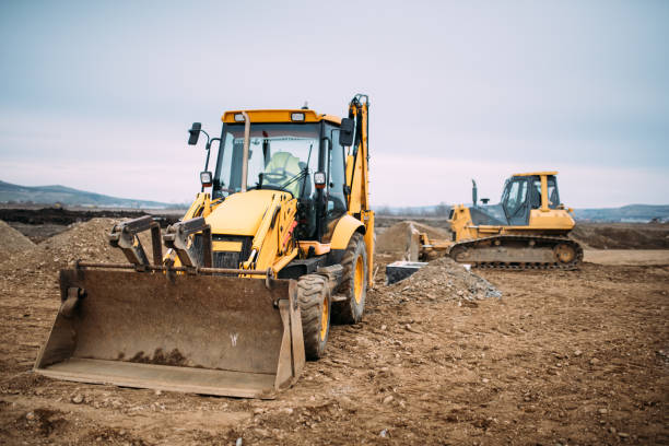 istock Industrial backhoe excavator loader and bulldozer machinery on construction site 956509290