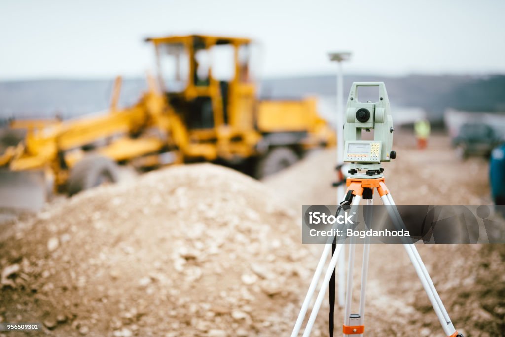 Surveyor equipment GPS system or theodolite outdoors at highway construction site. Surveyor engineering with total station Surveyor Stock Photo