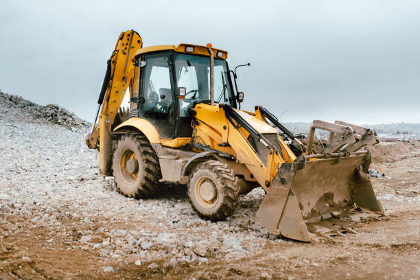istock details of massive working machinery, industrial backhoe loader 956509534