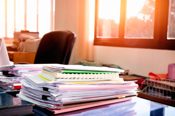 istock Pile of unfinished documents on office desk, Stack of business paper 956512522
