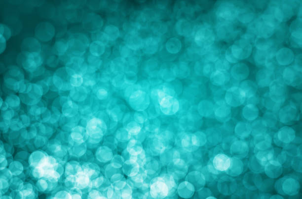 istock abstract yellow blue bokeh glitter sparkle background. 956513014