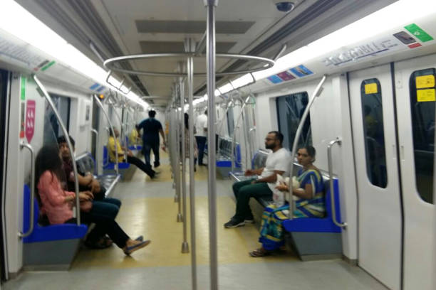Mumbai Metro train running and commuters sitting & standing in the metro. Comfortable, modern , fast, new & air conditioned way of transport in Mumbai India MUMBAI, INDIA - MAY 04, 2018 - commuters traveling in Mumbai Metro train local transport Mumbai, Maharashtra, India, Southeast Asia train air conditioner stock pictures, royalty-free photos & images