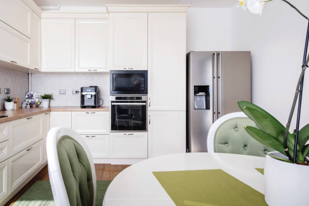 istock Modern kitchen area and wooden floor with modern refrigerator 956515724