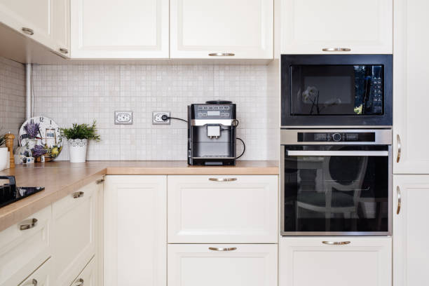 istock Modern design kitchen with electric appliances and wooden worktop 956515936