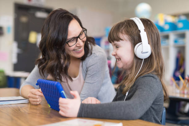 first graders in the classroom - self teach imagens e fotografias de stock