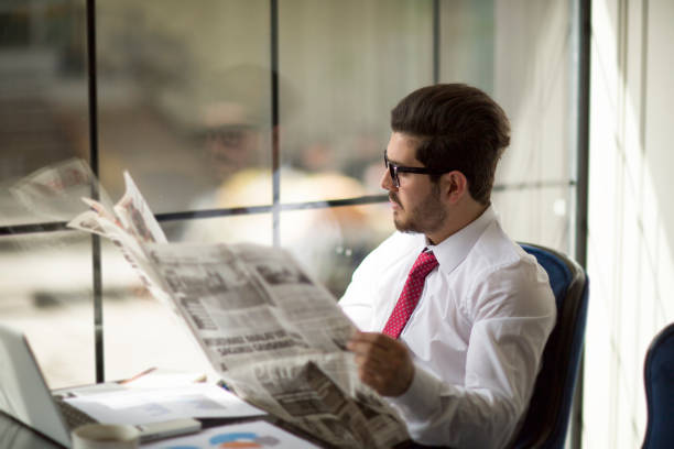 istock Businessman reading newspapers 956548638